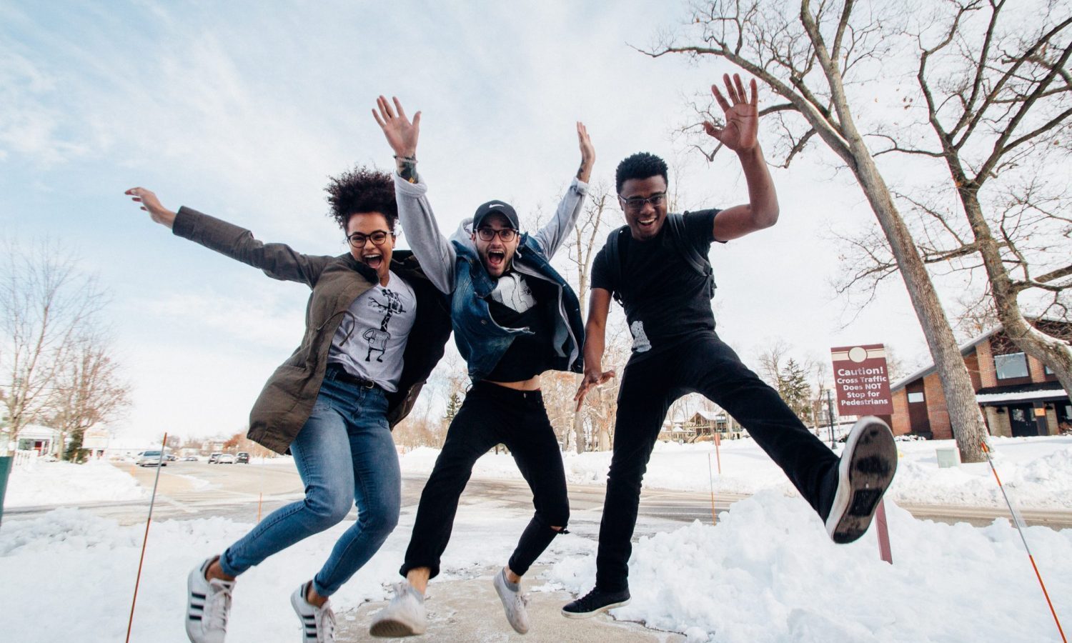 3 people excited and jumping around